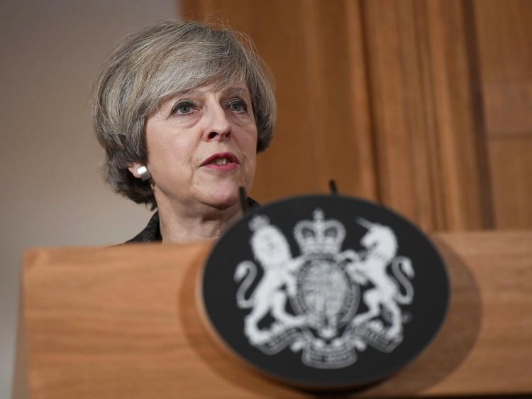 Stop corporation tax cuts to save the NHS, Theresa May warned