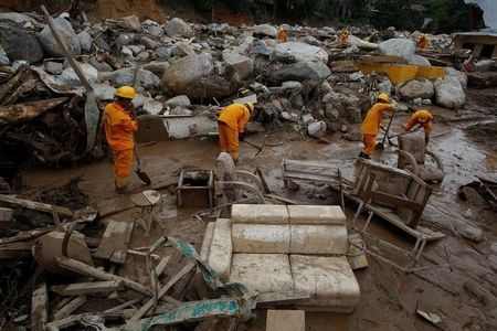 Colombia starts to bury 273 landslide victims, search continues
