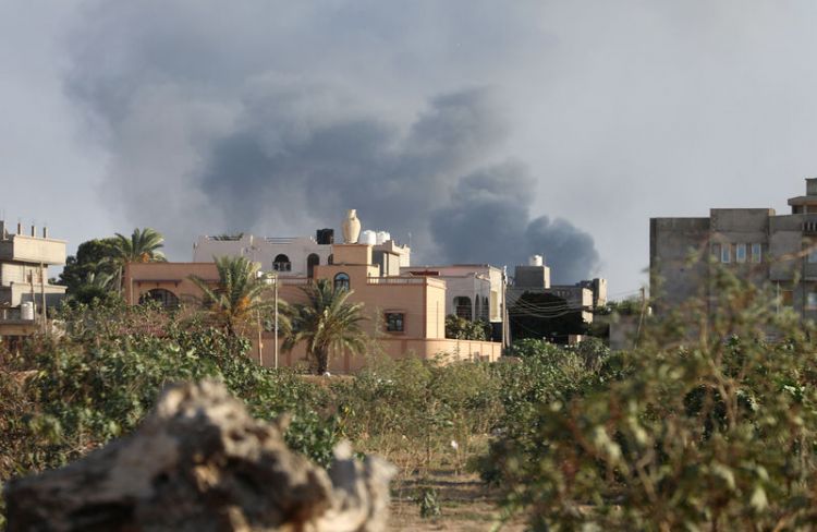 Libya evacuates with U.N. help migrants trapped by Tripoli clashes
