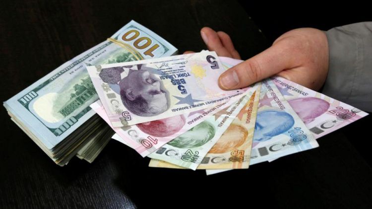Turkish lira steady against dollar; eyes on central bank