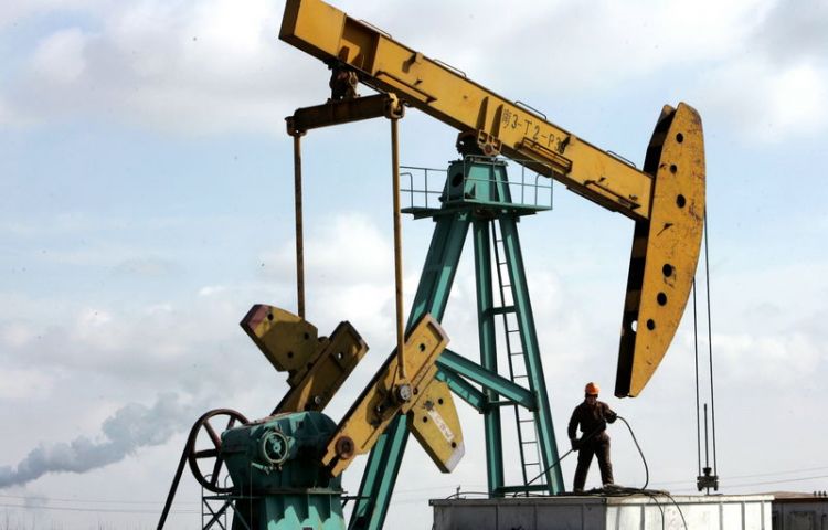 Oil prices edge up on surprise drawdown in U.S. crude stockpiles