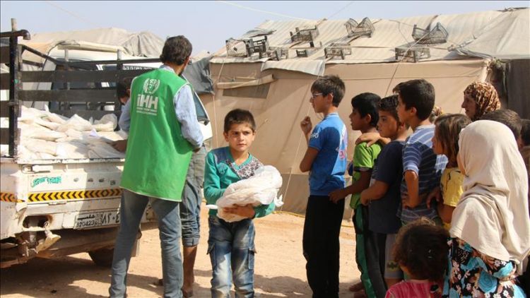 Turkish NGO distributes bread in Syria's Idlib