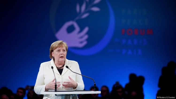 Germany's Angela Merkel pleads for world peace at Paris forum