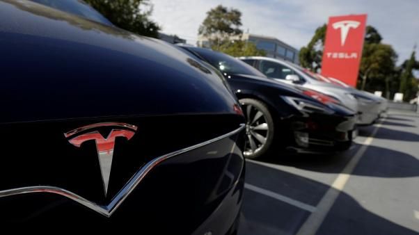Tesla cuts China car prices to absorb hit from trade war tariffs