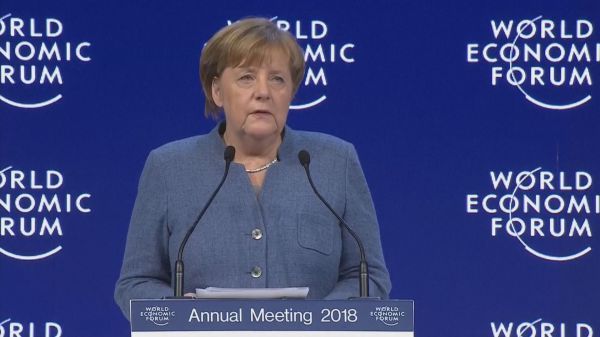 Angela Merkel tells Davos end of multilateralism means 'misery'