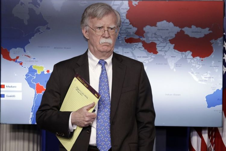Trump ramping up pressure on Maduro John Bolton's written note on 'troops to Colombia' raises eyebrows