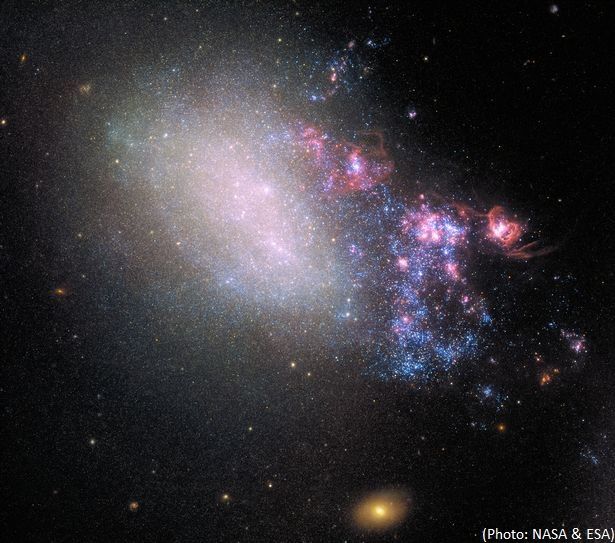 NASA captures stunning shot of galaxy blazing with stars born from 'hit-and-run'
