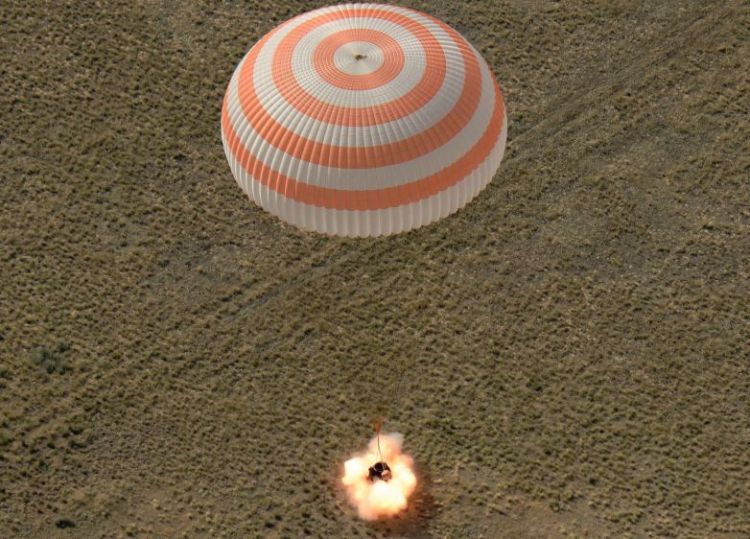 Trio of space travelers safely returns to Earth