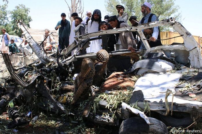 Taliban car bomb in Afghanistan kills at least 12 amid Doha peace talks Officials
