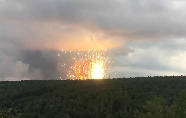 Explosions and fire hit ammunition depot in Siberia