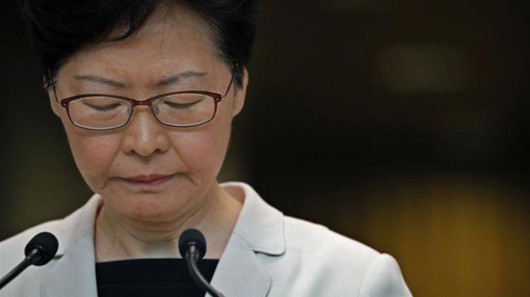 Hong Kong leader says she never discussed resigning with Beijing