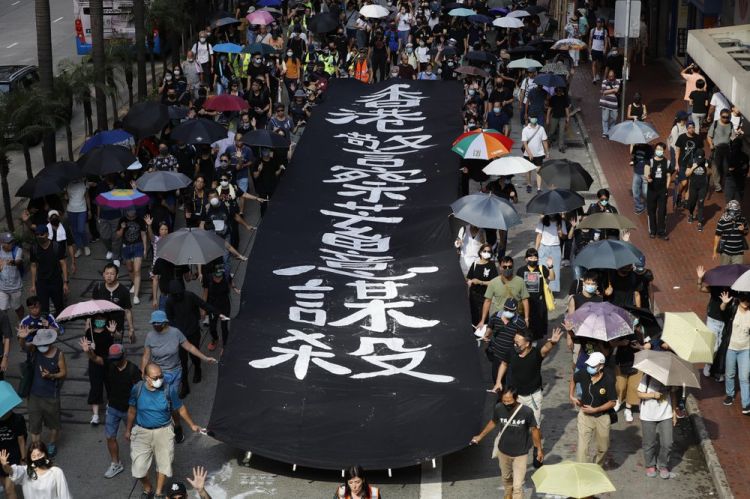 Hong Kong suspends trains, again rallies after ‘dark day’