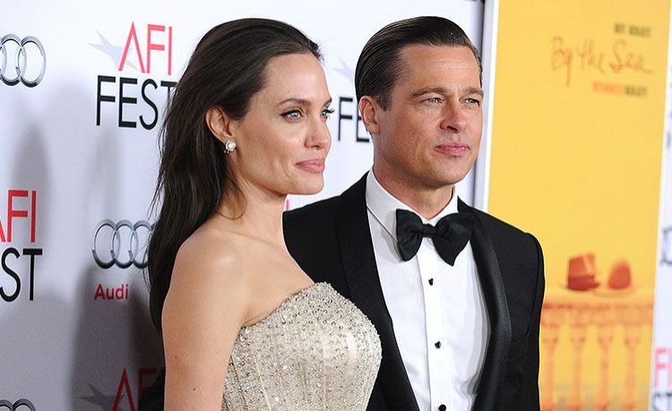 Angelina Jolie wants to live abroad but she can't because of Brad Pitt