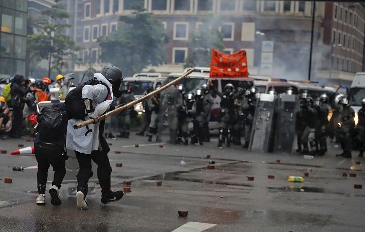 Hong Kong police officer shoots protester as violence flares