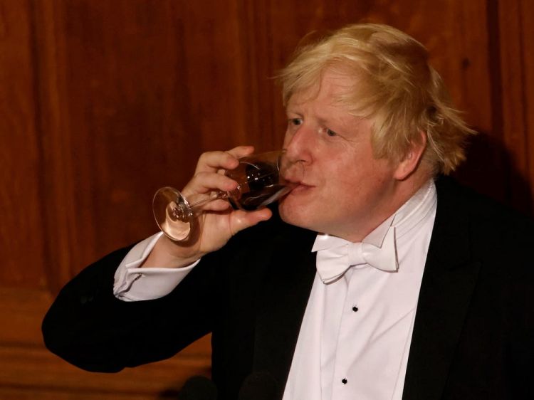 Boris Johnson back under pressure as new photo shows him with sparkling wine during Christmas quiz