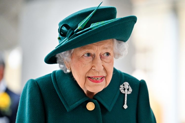 Queen Elizabeth tests positive for the coronavirus, as England is poised to relax rules.