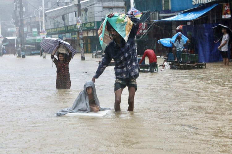 At least 59 dead in Bangladesh and India from storms and flooding