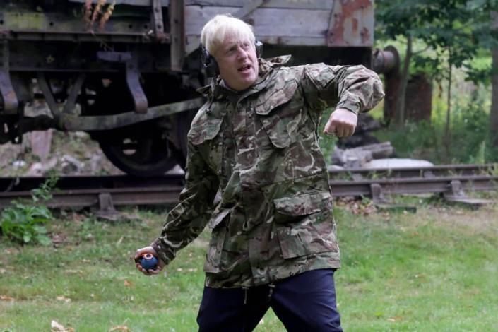 Boris Johnson throws a grenade as he visits Ukrainian troops training in Britain