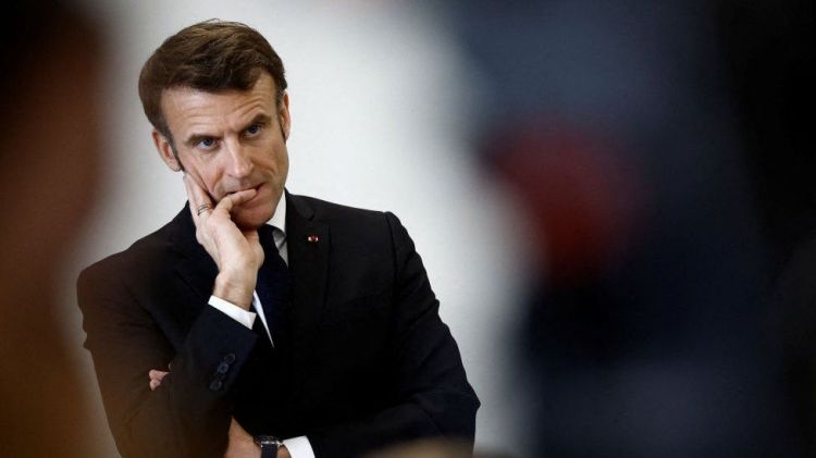 Macron's government survives no-confidence vote