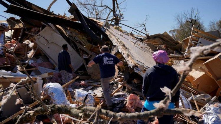 At least 26 dead as storms ravage parts of US