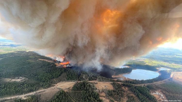 Floods, wildfires in western Canada displace thousands