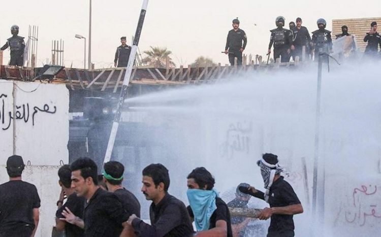 Iraqi police fire water cannon to disperse protesters at Swedish embassy