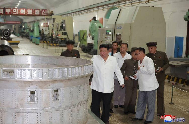 Kim visits factory, calls for faster missile output